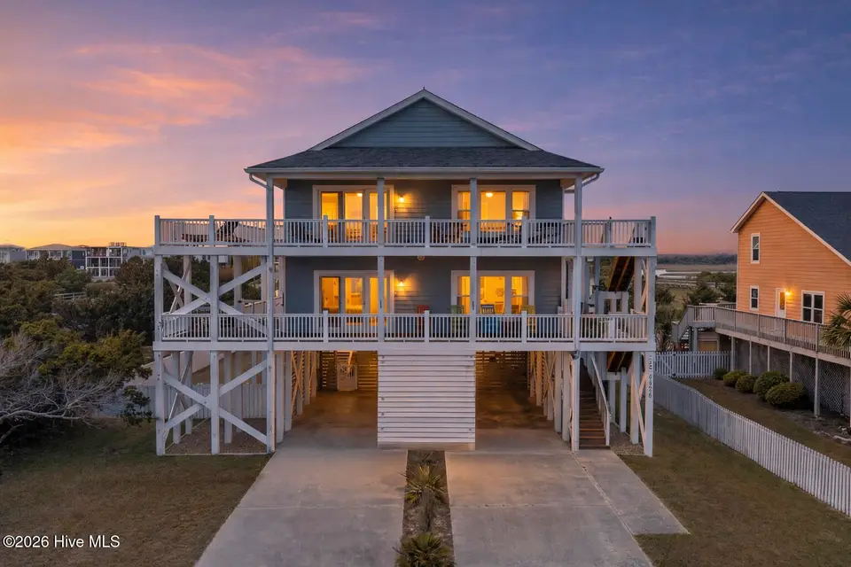 6626 W Beach Drive, Oak Island, NC 28465 – photo 1 of 72: 6626WestBeachDriveTwilight-1