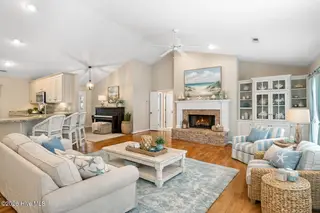 618 Oyster Bay Drive, Sunset Beach, NC 28468 – photo 9: Coastal living room with beach-inspired