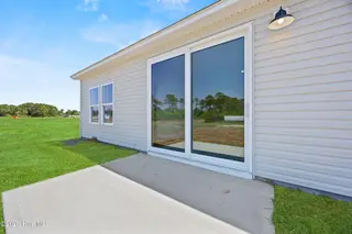 516 Getaway Lane 121, Shallotte, NC 28470 — 3-bedroom home in Summers Walk, Shallotte, NC, photo 24 of 25: 32_back patio