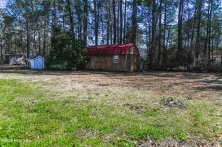 118 Woodland Drive, Swansboro, NC 28584 — 3-bedroom manufactured home in Hadnot Creek, Swansboro, NC, photo 14 of 16: Backyard