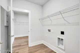 3200 Butterfly Ginger Street Lot 149, Leland, NC 28451 — 4-bedroom home in Indigo Preserve, Leland, NC, photo 23 of 39: Laundry Room