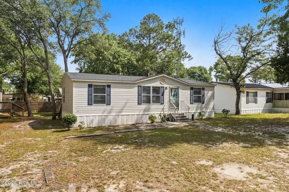 7203 Banner Street SW, Ocean Isle Beach, NC 28469 — 3-bedroom manufactured home in Seaside Heights, Ocean Isle Beach, NC, photo 1 of 38: House Front