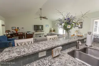 2086 Castlebridge Court NW, Calabash, NC 28467 — 3-bedroom home in Spring Mill, Calabash, NC, photo 15 of 59: kitchen island