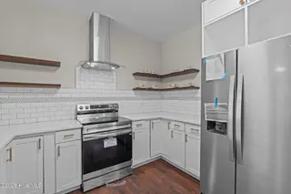 151 Creek Bend Drive, Vass, NC 28394 – photo 24: Range and Refrigerator
