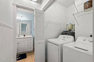 112 Oakleaf Drive 1003-A, Pine Knoll Shores, NC 28512 – photo 23: 2nd bath leads to laundry hallway