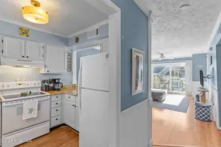 1000 Caswell Beach Road Apt. 806, Oak Island, NC 28465 — 2-bedroom condo in Oak Island Bch Villa, Oak Island, NC, photo 10 of 56: From Front Door Entry to Kitchen