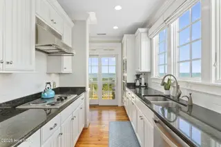 125 Roosevelt Drive, Pine Knoll Shores, NC 28512 — 5-bedroom home in Roosevelt Beach, Pine Knoll Shores, NC, photo 6 of 61: Modern kitchen w/ great views