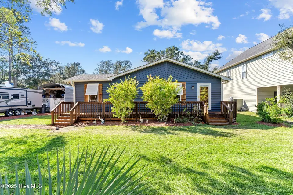 211 NE 55th Street, Oak Island, NC 28465 – photo 1 of 52: Welcome Home!