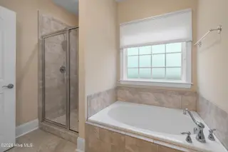 123 Bellwood Circle, Sunset Beach, NC 28468 – photo 21: Primary bathroom