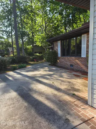 63 Carolina Shores Drive, Carolina Shores, NC 28467 – photo 3: Paved area at entrance