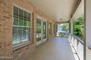 110 Sutton Drive, Cape Carteret, NC 28584 – photo 16: Spacious & shady screened porch