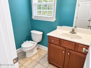 776 Jim Grant Avenue, Sneads Ferry, NC 28460 — 3-bedroom home in Grantwood, Sneads Ferry, NC, photo 7 of 20: JG half bath