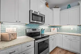 3504 E Beach Drive, Oak Island, NC 28465 – photo 14: 46-web-or-mls-DSC04281