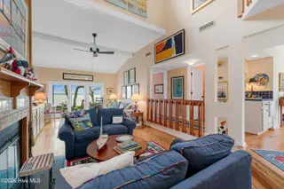 590 Westport Drive H1 Westport, Pine Knoll Shores, NC 28512 – photo 11: Living room with sound views