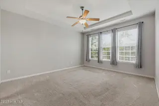 212 Cable Lake Circle, Calabash, NC 28467 – photo 18: Master bedroom flooded with sunlight