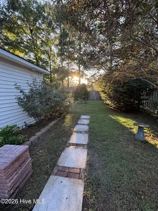 637 Lanvale Hills Circle, Leland, NC 28451 — 3-bedroom home in Lanvale Trace, Leland, NC, photo 12 of 15: Path to Backyard