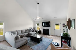 107 Peletier Shores Drive, Peletier, NC 28584 – photo 5: Living room with electric fireplace