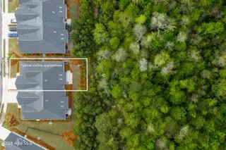 8983 Mango Bay Court NE, Leland, NC 28451 — 4-bedroom townhome in Compass Pointe, Leland, NC, photo 24 of 53: Wooded Area