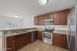 3414 Richard Court, New Bern, NC 28560 — 3-bedroom home in Pinecrest Estates, New Bern, NC, photo 14 of 38: another view of kitchen