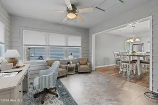 606 Camellia Lane, Sunset Beach, NC 28468 – photo 20: Sunroom virt staging