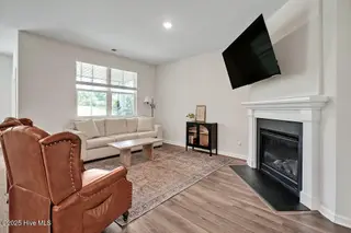 1325 Clendon Circle, Leland, NC 28451 – photo 10: Living Room - Gas log fireplace