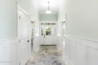 1454 Dunes Boulevard SW, Ocean Isle Beach, NC 28469 – photo 5: Foyer- flooring has been removed