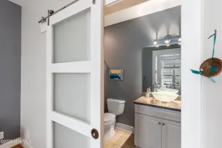 2790 Creek Bridge Court, Southport, NC 28461 — 3-bedroom home in St James, Southport, NC, photo 23 of 72: Barn Door to Suite 2 Private Bath