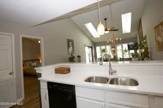 171 Cranes Cove, Vass, NC 28394 – photo 21: 11a_Kitchen-Sink-View-Toward-Bedroom_171