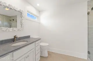 413 Club Colony Drive, Atlantic Beach, NC 28512 – photo 14: Primary ensuite