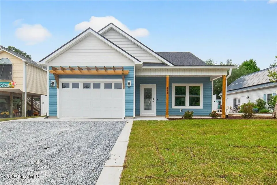 137 NE 3rd Street, Oak Island, NC 28465 – photo 1 of 30: Front of Home