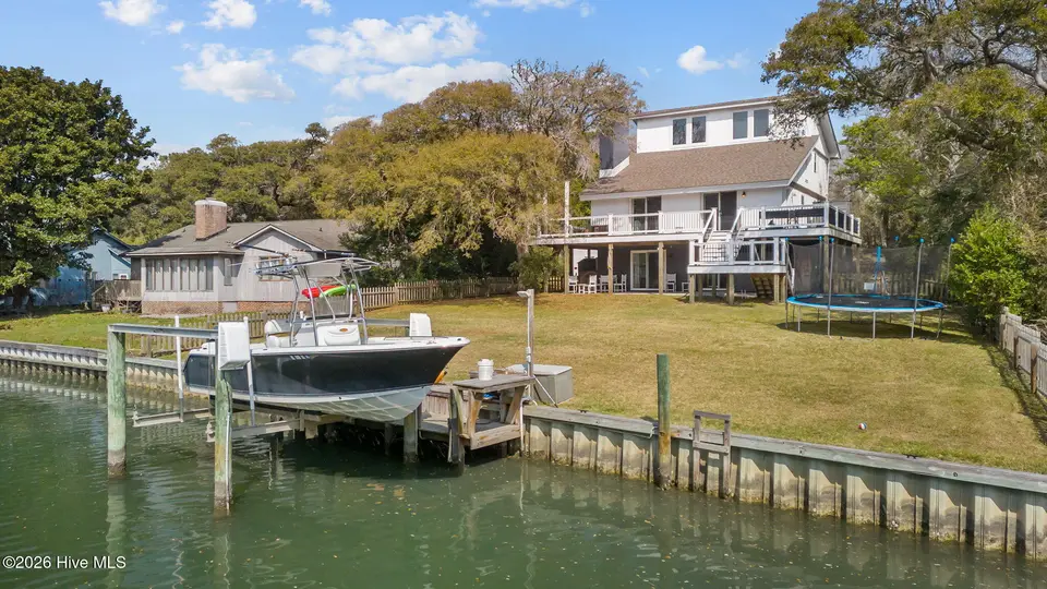 125 Loblolly Drive, Pine Knoll Shores, NC 28512 – photo 1 of 68: Dock and home