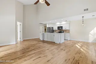 212 Kings Trail # A, Sunset Beach, NC 28468 – photo 10: Upstairs LR to kitchen