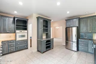 86 Plantation Passage Drive SE, Bolivia, NC 28422 — 4-bedroom home in Winding River Plantation, Bolivia, NC, photo 13 of 77: Kitchen
