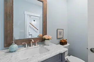 3604 W Pelican Drive, Oak Island, NC 28465 – photo 11: 1st Floor Half Bath