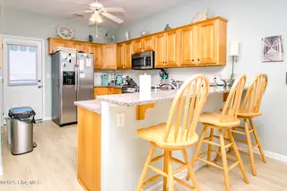 1131 S Shore Drive, Surf City, NC 28445 – photo 3: Kitchen with Eat-In Seating