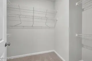 1210 Sunwater Terrace, Leland, NC 28451 — 3-bedroom townhome in Grand Park, Leland, NC, photo 17 of 46: Primary closet