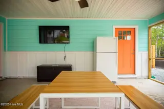 221 NE 58th Street, Oak Island, NC 28465 – photo 17: SCREENED IN PATIO