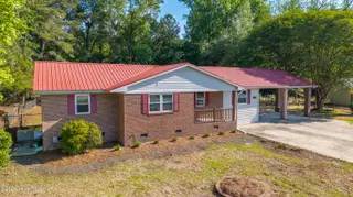 11073 Sam Potts Highway, Lake Waccamaw, NC 28450 – photo 1: 56-DJI_20260418093702_0031_D-2-HDR
