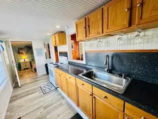 4021 E Beach Drive, Oak Island, NC 28465 – photo 9: IMG_2356