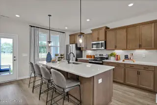 1218 Sunwater Terrace, Leland, NC 28451 — 4-bedroom townhome in Grand Park, Leland, NC, photo 11 of 49: Kitchen - Hyacinth BE - Grand Park