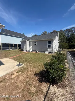 115 NW 17th Street, Oak Island, NC 28465 — 2-bedroom home in Pinners Point, Oak Island, NC, photo 5 of 7: Rear Yard