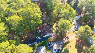243 Ocean Forest Drive NW, Calabash, NC 28467 — 3-bedroom manufactured home in Ocean Forest, Calabash, NC, photo 21 of 61: DJI_20251101095829_0007_D
