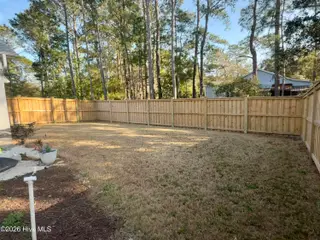2487 Lake Ridge Drive, Southport, NC 28461 – photo 5: Backyard fence