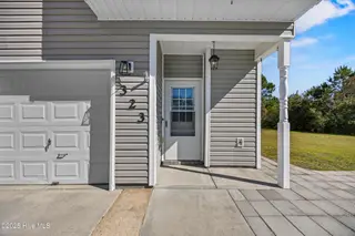 323 Cedar Island Trail, Holly Ridge, NC 28445 — 3-bedroom townhome in The Landing At Folkstone, Holly Ridge, NC, photo 4 of 36: 8_front entryway