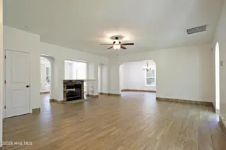 39 Forest Lake Drive, Jackson Springs, NC 27281 – photo 14: 14 Living Room w fireplace opening to di