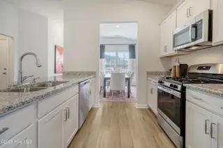 1149 Tennessee Walker Way, Bolivia, NC 28422 — 3-bedroom home in River Tide Farms, Bolivia, NC, photo 8 of 19: Kitchen to Dining Room
