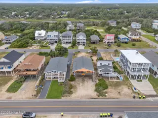210 W Beach Drive, Oak Island, NC 28465 – photo 7: 7-web-or-mls-DJI_20250614140122_0272_D