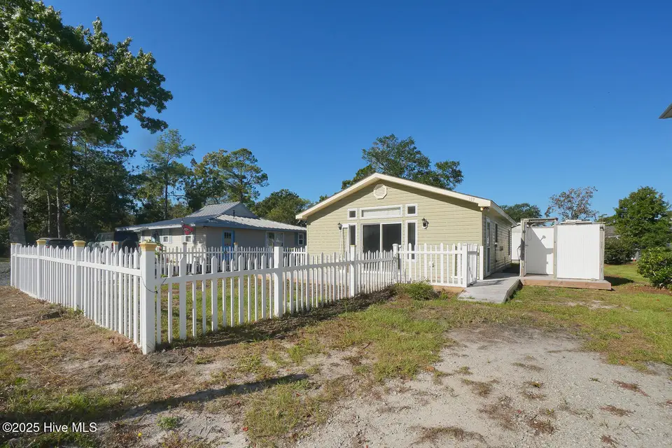127 NW 10th Street, Oak Island, NC 28465 – photo 1 of 21: 127 NW 10th St Oak Island NC-large-004-0