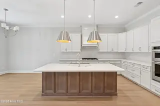 1562 St. Lucia Drive SW, Shallotte, NC 28470 – photo 7: Kitchen and Dining Rooms