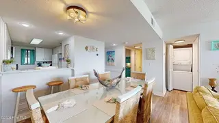 8801 Reed Drive 115, Emerald Isle, NC 28594 – photo 10: Dining Area w/ Eat-In Kitchen Bar